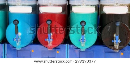 italian shave ice machine with many colored flavors and iced at the bar