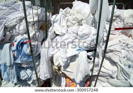 giant pile of dirty laundry in the industrial laundry before washing