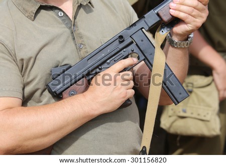 soldier in uniform with a gun in his hand in training camp for new recruits
