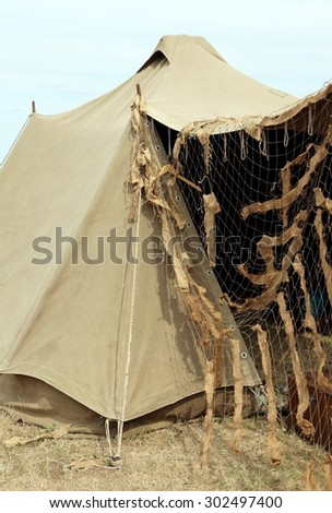 camouflage military tent in the camp of training of new recruits