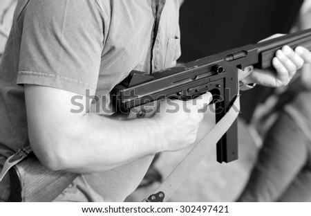 soldier in uniform with a submachine gun in his hand in training camp for new recruits