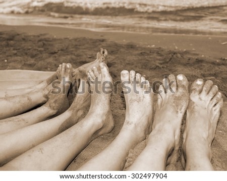 ten feet of a family by the sea on the beach in summer