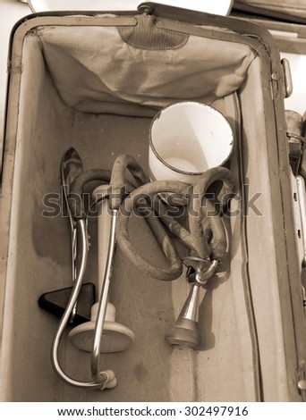 medical Briefcase with antique medical instruments and an old stethoscope