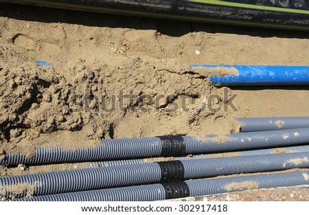 corrugated pipes for laying electric cables in the excavation in road construction