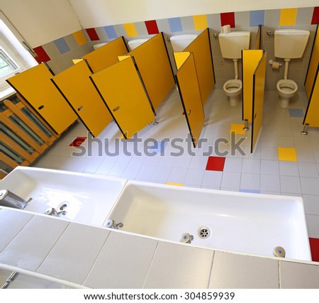 small ceramic toilets and sinks in the bathroom of the kindergarten