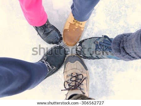 five shoes of a family on vacation in the mountains