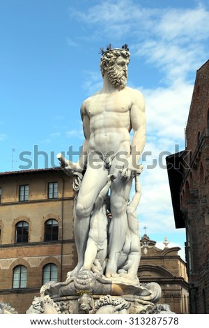 White statue of Neptune in the ancient fountain in Florence ITALY  in Piazza della Signoria