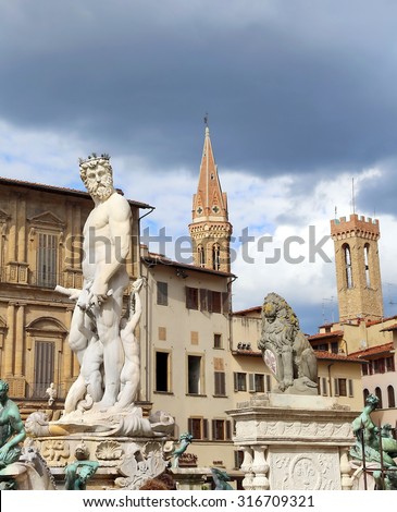 White statue of Neptune in the ancient fountain in Florence Italy