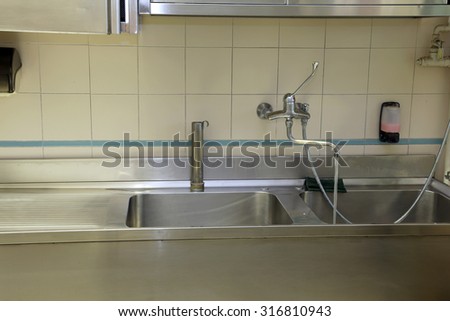 large stainless steel sink of industrial kitchen for preparing food for many people