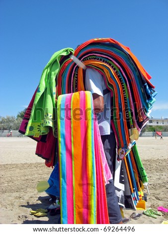 peddler seeking customers in a sunny Italian beach