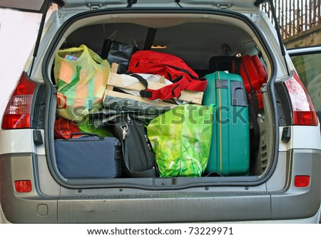 overloaded trunk of a car leaving for the winter holidays with your family