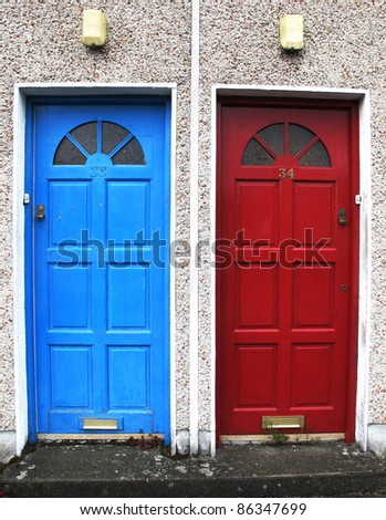 two doors with bright colors at the entrance to a house in Northern Europe