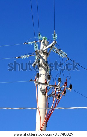 high mast with cables to transport electricity to homes and factories