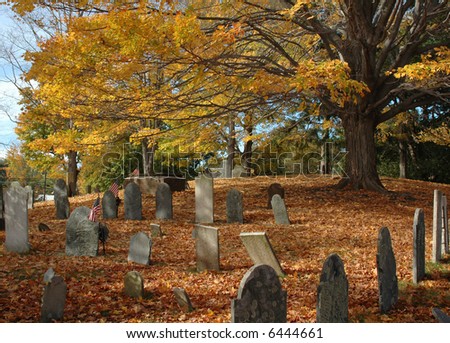 Old New England cemetery under a canopy of fall foliage in late October