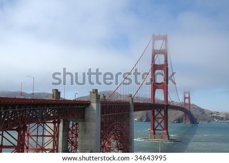 Fog rolls in across the Golden Gate Bridge in San Francisco, California, on a summer day