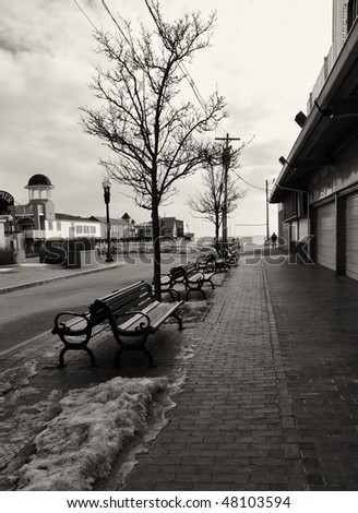 Arcade area of Old Orchard Beach abandoned for the winter except for one lone walker in the distance