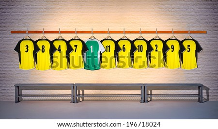 Row of Yellow Football Shirts with Green Shirt 3-5