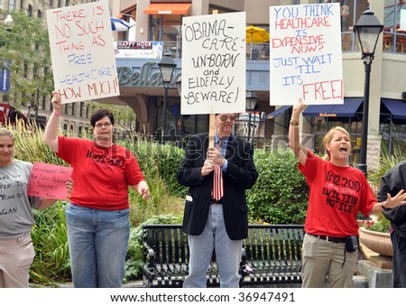 MINNEAPOLIS - SEPTEMBER 12: Health Care Reform protesters hold placards outside of Barack Obama\'s Health Care speech at the Target Center on September 12, 2009 in Minneapolis.