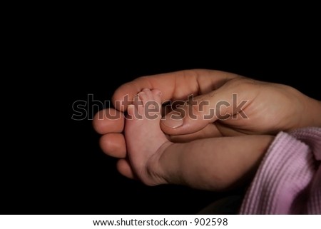 Father holding Daughters foot