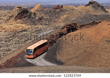Touristic bus making round trip in the Timanfaya desert, Lanzarote, Spain
