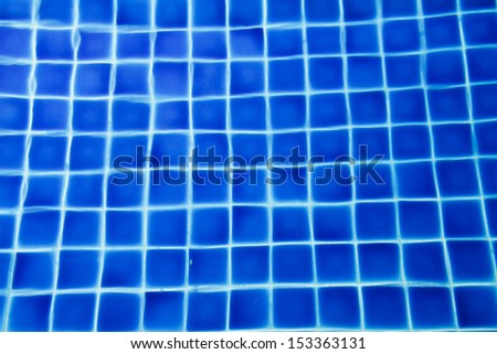 rippled pattern of clean water in a blue swimming pool