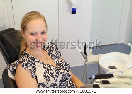 Dental patient in chair smiling