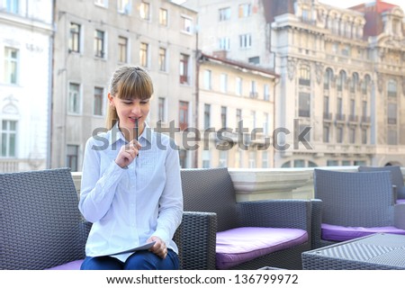 young businesswoman working in a restaurant terrace