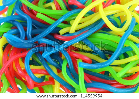 Background photo : Assortment of colorful fruity Gummy Spaghetti