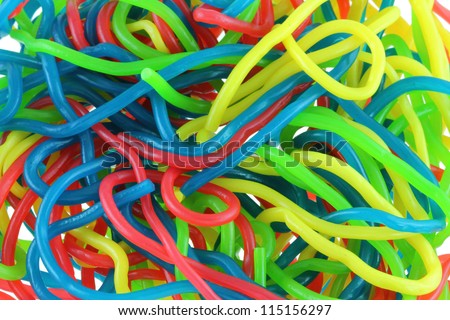 Assortment of colorful fruity Gummy Spaghetti isolated on white background