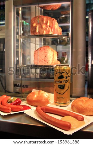 VIENNA, AUSTRIA - AUGUST 2012 : Beer and sausages at Wurstelstande (Hot dog stand) on Kaerntner Strasse shopping street on August 8, 2012, Original Vienna\'s sausage stands in Central Vienna, Austria