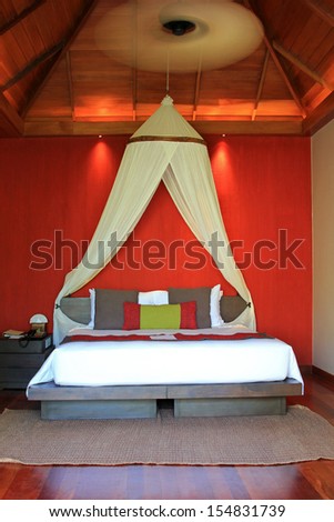 PHA NGAN ISLAND, THAILAND - JUNE 21 : A Room decorated with Asian style with palm leaf-shaped ceiling fan on 21 June 2012 in Koh Pha ngan, the south of Thailand