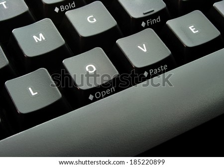Keyboard with alphabets L-O-V-E, plus a word \'find\' on the top-right, conceptual idea for finding love online.