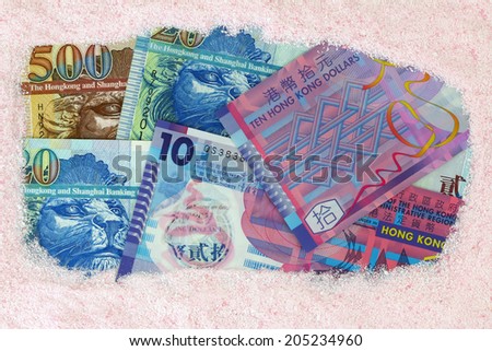 Money laundry : Hong kong dollar banknotes under pink Laundry washing powder