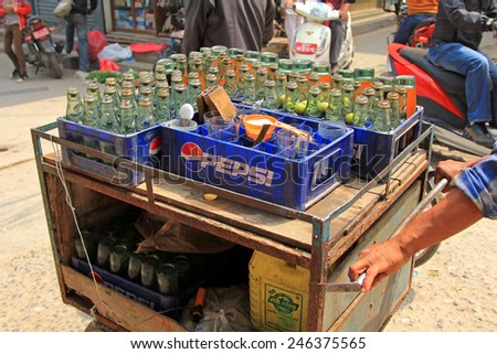 PATAN, NEPAL - APRIL 2014 : A street vendor selling Fresh Lime Soda in Patan, Nepal on 13 April 2014. Fresh lime soda is a beverage in Nepal which consists of lime juice, sugar and club soda