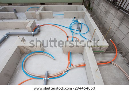 Foundation work of the house. Water and sewage pipes. Japan.