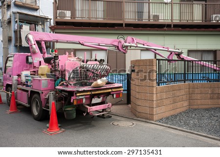 Housing construction. Ready-mixed concrete injection from the concrete mixer truck to pump car.