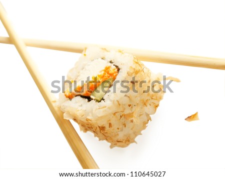 sushi rolls with tuna flakes and chopsticks over white