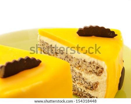 Slices of delicious mango cake with poppy on plate