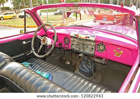 HAVANA - JANUARY 29: The interior of a pink Buick parked outside the Hotel Nacional de Cuba in Havana on January 29, 2009. American classic cars are often used as taxis for tourists in Havana.
