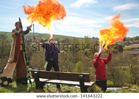 CLUN - MAY 6: Performers breathing fire at the Green Man Festival in Clun, Shropshire on May 6, 2013. The Festival is an annual May Day Bank Holiday Celebration.