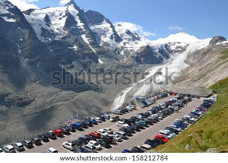 GROSSGLOCKNER - AUGUST 16: car park overlooking the Pasterze Glacier and the Grossglockner, Austria on August 16, 2013. The glacier has decreased in size by half since 1851 due to global warming.