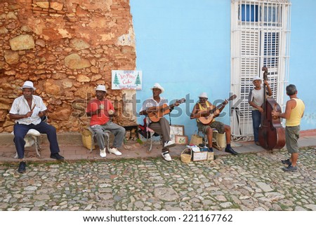 Trinidad - July 27: musicians play in the street in Trinidad, Cuba on July 27, 2014. Cuban music is popular throughout the world and is influenced by West African and Spanish music.