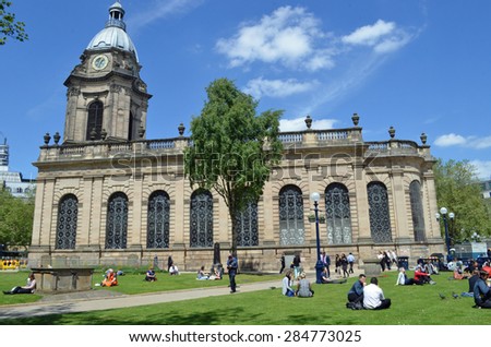 Birmingham, UK - June 4: St Philip\'s Cathedral with people at lunchtime in Birmingham, UK on June 4, 2015. It is the third smallest cathedral in England.