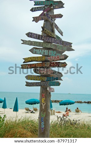 rustic wooden signpost to destinations on beach at Fort Zachary, Key West