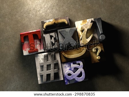 Wooden printing blocks form word \'Text\'. Graphic look at type and typography by using the old wooden printing press blocks.