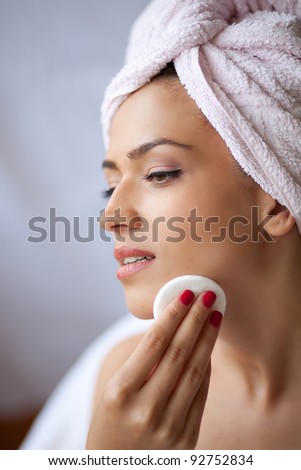Relaxing during a facial steam treatment at a beauty spa.