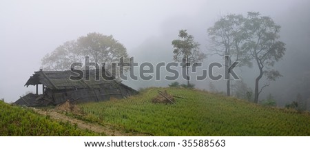Old mountain farm-house in mist