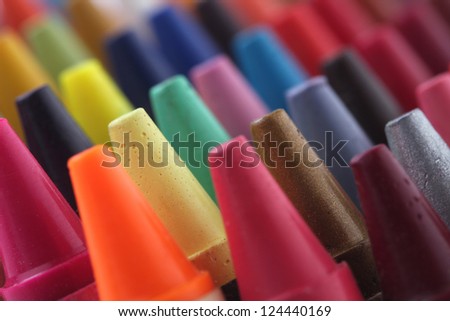 Colorful pastel(crayon) pencils tips for children and others used for kids drawing & coloring arranged attractively in rows and columns making a stunning display of colors