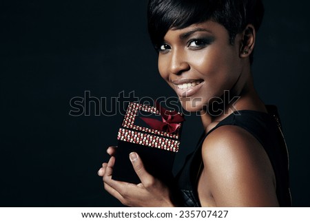 beauty black woman holding a gift