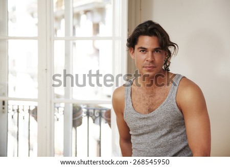 man in light room with window. lifestyle photo